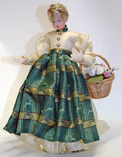 Wax Girl in Ivory Dress with Green Pinafore by Margarete and Leonore Leidel in Iffeldorf